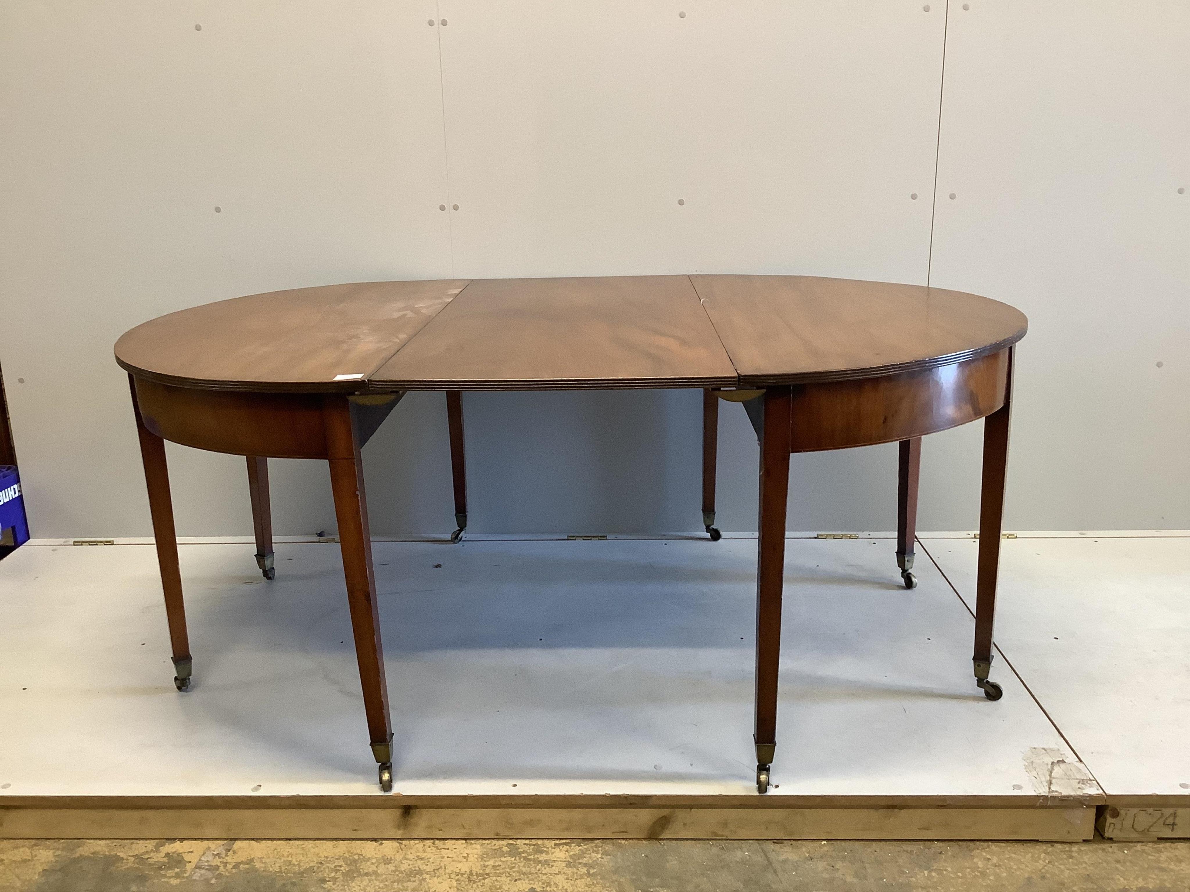 A George III mahogany D end dining table, with one leaf, width 122cm, extends to 175cm, height 70cm. Condition - a little faded otherwise fair to good condition